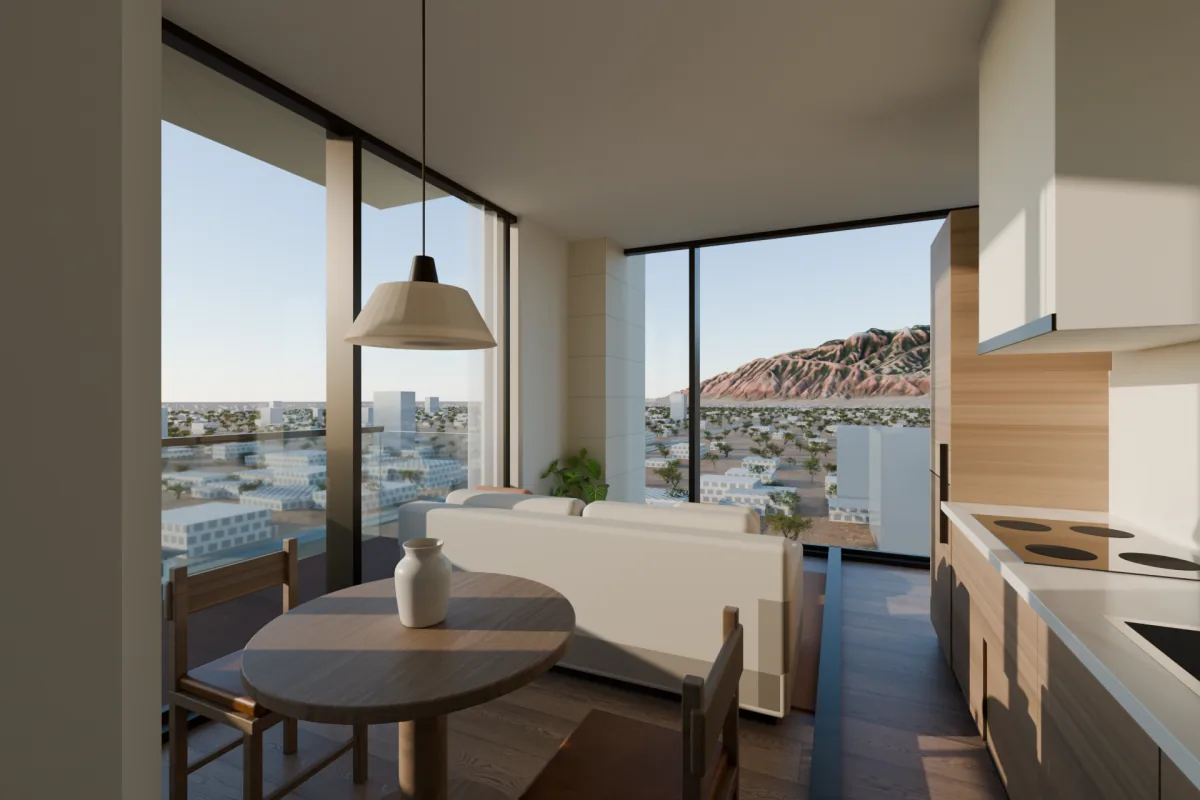 Small apartment living room with a round dining table, a sofa, a kitchen along one wall and corner windows facing the mountains.